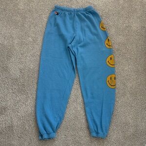 Aviator Nation Blue sweatpants with Smiley Face Design